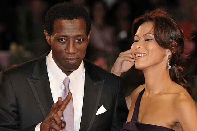 A close look at Wesley Snipes and his wife Nakyung Park. 